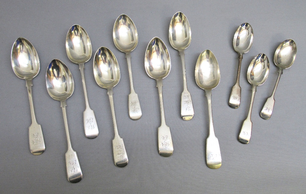EIGHT GEORGIAN AND VICTORIAN FIDDLE PATTERN TABLESPOONS AND THREE DESSERT SPOONS, ALL MONOGRAMMED (