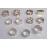 TWO VICTORIAN AND EIGHT LATER SILVER NAPKIN RINGS AND AN OCTAGONAL NAPKIN RING (189g) [11]