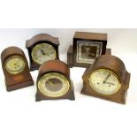 FOUR OAK MANTEL CLOCKS, EACH WITH A STRIKING EIGHT DAY MOVEMENT AND AN INLAID MAHOGANY TIMEPIECE [