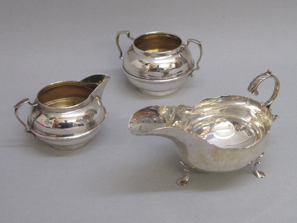 SILVER JUG AND SUGAR BOWL BY C B&S, LONDON 1933 TOGETHER WITH A SILVER GRAVY BOAT, LONDON 1907 (