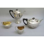 VICTORIAN MATCHED SILVER TEA AND COFFEE SET OF SEMI-FLUTED OVAL FORM COMPRISING A TEAPOT, COFFEE