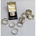 SIX SILVER NAPKIN RINGS, VARIOUS MAKERS, TOGETHER WITH A SET OF FOUR OTHER NAPKIN RINGS (121g)
