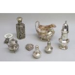 GERMAN SILVER CREAM JUG (INDISTINCT HALLMARKS), LONDON, A SILVER SUGAR SIFTER (NO GIVEN HALLMARK), A