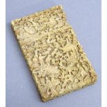 LATE C19th CHINESE CANTON IVORY CARD CASE CARVED WITH FIGURES AND BUILDINGS IN A GARDEN (10.8cm