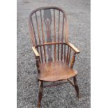 VICTORIAN ASH, ELM AND BEECH WINDSOR ARM CHAIR WITH A PIERCED SPLAT AND SPINDLE ARCHED BACK, ON