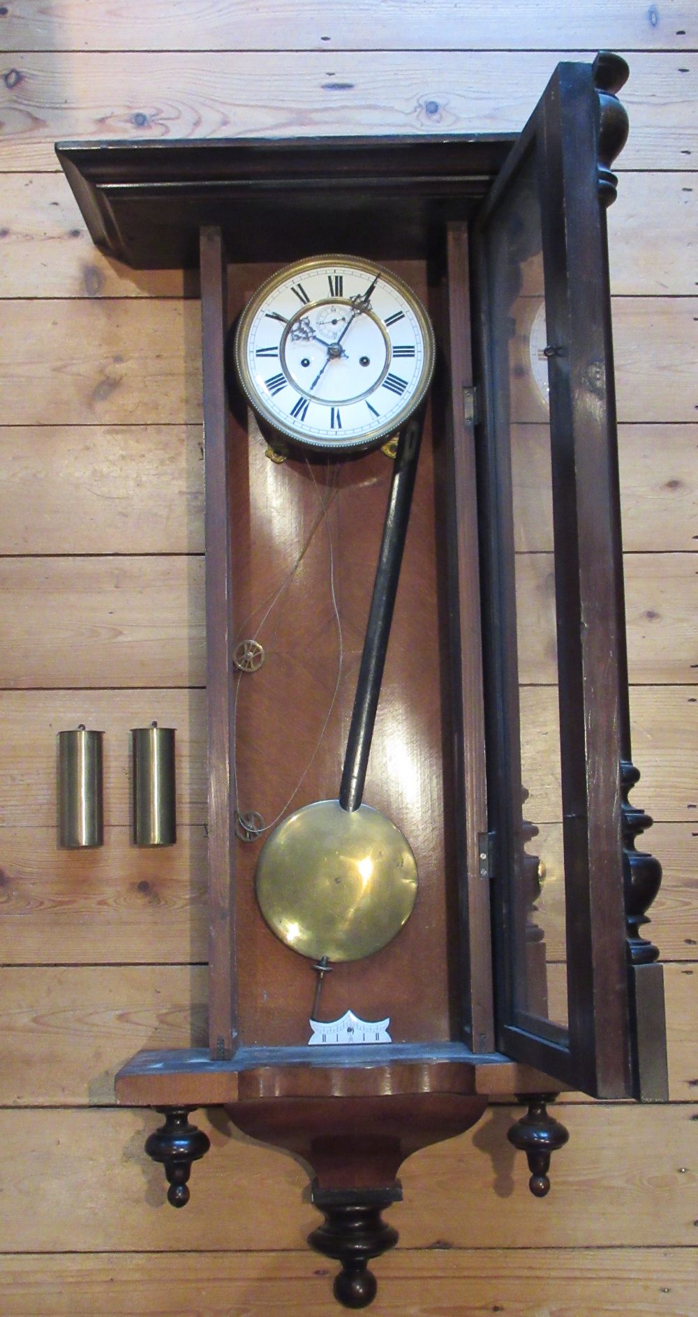 VIENNESE STYLE WALL REGULATOR WITH A WHITE ENAMELLED CIRCULAR DIAL AND SECONDS DIAL ENCLOSING A TWO