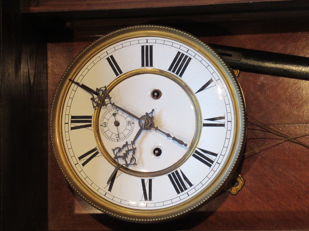 VIENNESE STYLE WALL REGULATOR WITH A WHITE ENAMELLED CIRCULAR DIAL AND SECONDS DIAL ENCLOSING A TWO - Bild 3 aus 4