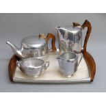 PICQUOT WARE FIVE PIECE TEA SERVICE COMPRING TRAY, TEAPOT, HOT WATER JUG, MILK JUG AND SUGAR BOWL [