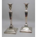 PAIR OF EARLY 20th CENTURY SILVER TAPERING SQUARE COLUMN CANDLESTICKS BY HAWKSWORTH & Co.,