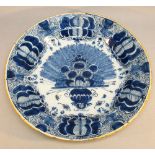 DUTCH DELFT CIRCULAR DISH WITH PAINTED BLUE AND WHITE FLORAL DECORATION (DIA: 31.8cm)