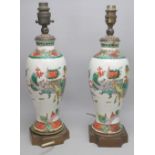 PAIR OF CHINESE PORCELAIN BALUSTER VASES, EACH PAINTED WITH FIGURES AND HORSES, ON A GILT METAL