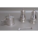 ARTS AND CRAFTS SILVER THREE PIECE CRUET SET COMPRISING A BALUSTER SALT POT WITH REEDED AND ROPE-