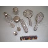 SILVER FOUR PIECE DRESSING TABLE SET WITH EMBOSSED FLORAL AND MASK DECORATION, BY B&Co.,