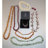 CHINESE GREEN HARDSTONE BEAD NECKLACE WITH SILVER GILT FILIGREE CLASP, THREE AMBER COLOURED BEAD