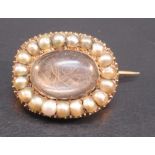 MID 19th CENTURY SPLIT PEARL MEMORIAL BROOCH OF ROUNDED RECTANGULAR FORM, CRYSTAL COVERED HAIR PANEL