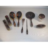 SILVER AND TORTOISESHELL NINE PIECE DRESSING TABLE SET COMPRISING TWO PAIRS OF BRUSHES, HAND MIRROR,