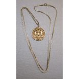 ITALIAN YELLOW METAL FINE BOX-LINK CHAIN MARKED 750 AND A BAHRAINI? YELLOW METAL PENDANT EMBOSSED