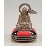 UNUSUAL BUDDHA PENDANT "SEAL" WATCH WITH INSET RED AND BLACK HARDSTONES AND OCTAGONAL DIAL,