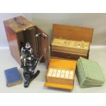 BECK, LONDON, JAPANNED MICROSCOPE WITH TWO LENSES ETC. IN AN OAK CASE (MINIMUM HEIGHT 29cm), TWO