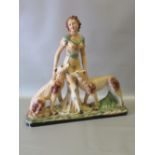 ART DECO STYLE PLASTER GROUP OF A YOUNG WOMAN WITH TWO HOUNDS, WITH PAINTED DECORATION (53cm x