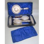 A LADY'S SILVER DRESSING TABLE SET COMPRISING A PAIR OF HAIRBRUSHES, CLOTHES BRUSH, COMBS AND A HAND