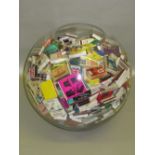 LARGE GLASS SPHERICAL VASE (DIA: 36cm) CONTAINING A FEW HUNDRED BOOK MATCHES AND A FEW MATCHBOXES [