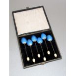 SET OF SIX GEORGE V COFFEE SPOONS, EACH WITH A BLUE GUILLOCHE ENAMELLED BACK AND IVORY COFFEE BEAN