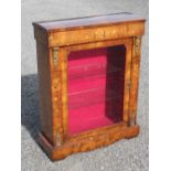 VICTORIAN INLAID WALNUT CABINET WITH A GLAZED PANELLED DOOR AND GILT METAL MOUNTS, ON A PLINTH