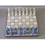 LIMOGES PORCELAIN CHESS SET OF 32 BLUE AND IVORY PIECES, GILT ENRICHED (HEIGHT OF KING 7.3cm), ON