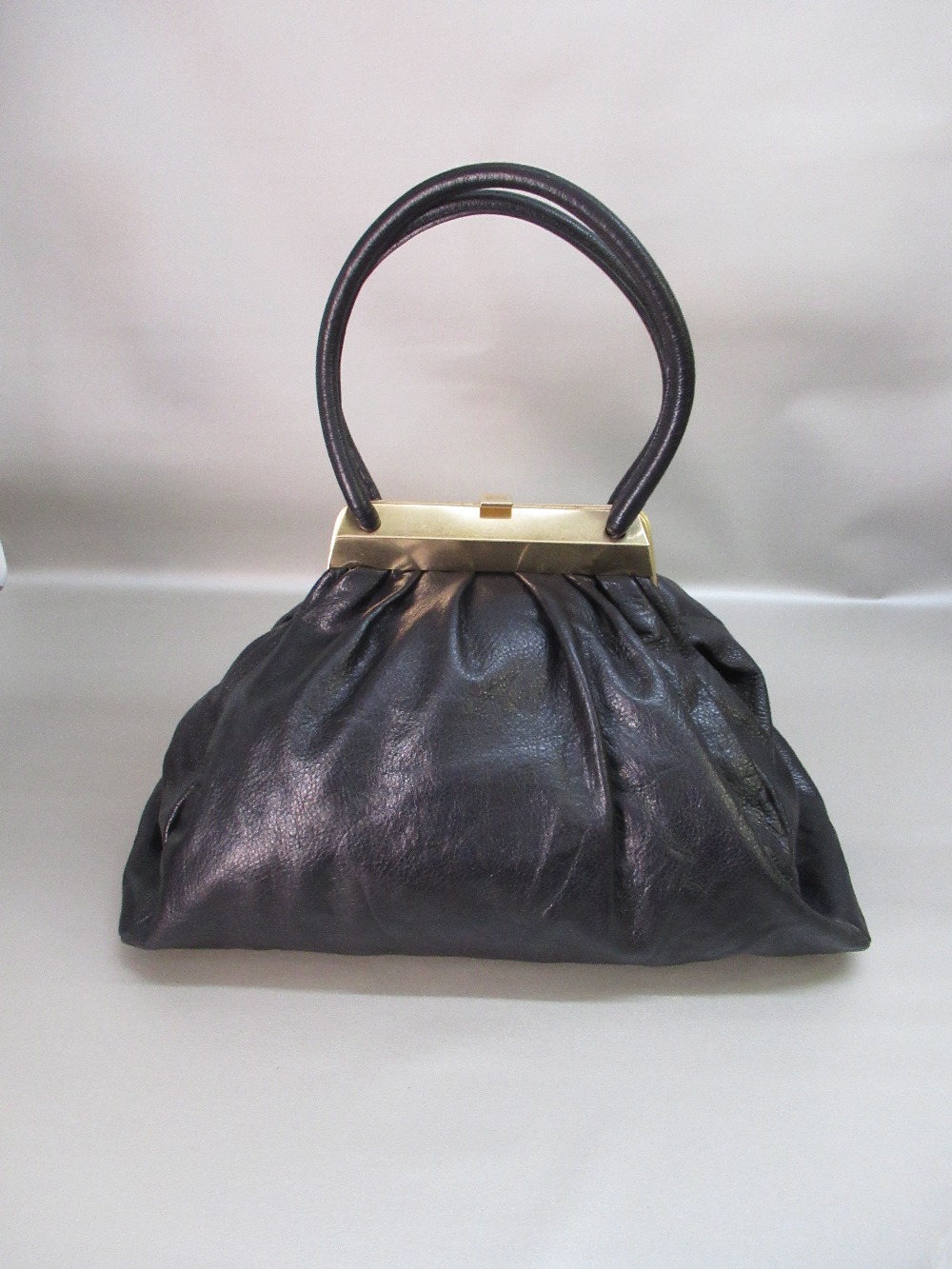 SONIA RYKIEL BLACK LEATHER HANDBAG WITH GILT METAL SNAP CLASP AND TWO LEATHER HANDLES, W: 44cm,