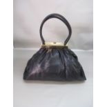 SONIA RYKIEL BLACK LEATHER HANDBAG WITH GILT METAL SNAP CLASP AND TWO LEATHER HANDLES, W: 44cm,