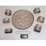 EASTERN SILVER FILIGREE CIRCULAR DISH (DIA: 15.5cm), SIX SILVER NAPKIN RINGS AND A SILVER BOTTLE