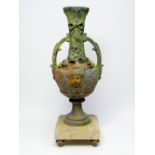 LATE 19TH CENTURY CONTINENTAL WEATHERED SPELTER VASE WITH FLORAL AND MASK DECORATION IN RELIEF AND