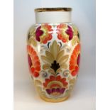 EAST EUROPEAN LARGE EARTHENWARE VASE, PAINTED WITH FLOWERS WITH A GILT RIM AND BASE, INSCRIBED AND