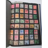 A STAMP ALBUM CONTAINING VICTORIAN AND LATER STAMPS OF THE WORLD.