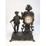 A LATE 19TH CENTURY FRENCH BAROMETER WITH AN ANEROID MOVEMENT IN A BRONZE SPELTER CASE MOUNTED