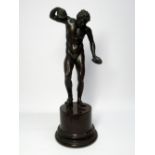 A LATE 19TH CENTURY BRONZE DANCING FAUN WITH CYMBALS, AFTER THE ANTIQUE, ON A RED SERPENTINE