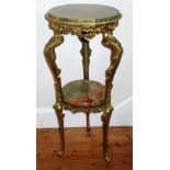 ITALIAN ORNATE BRASS STAND WITH A GREEN ONYX CIRCULAR TOP AND UNDERTIER ON THREE SHAPED FEET (H.