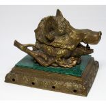 A VICTORIAN BRASS BOAR'S HEAD DESK TIDY INKWELL, SET ON A MALACHITE EFFECT CERAMIC TILE AND PIERCED