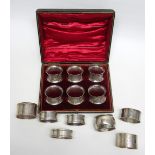 SET OF SIX LATE VICTORIAN NAPKIN RINGS, EACH OF WAISTED CIRCULAR FORM WITH CHASED FLORAL