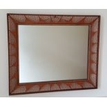 STUART DEVLIN ROSEWOOD RECTANGULAR WALL MIRROR WITH CARVED AND PIERCED FILIGREE DECORATION.