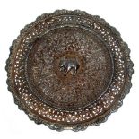 A BURMESE PIERCED SILVER CIRCULAR PLAQUE (DIA. 23.5 CM), WITH SCROLLING FLORAL AND FOLIATE BANDED