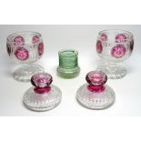 A PAIR OF BOHEMIAN GLASS CIRCULAR JARS EACH WITH FIVE CRANBERRY FLASH FLORAL AND RIBBON ROUNDELS AND