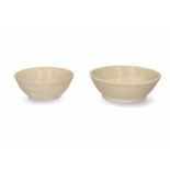 Two similar Ding lotus bowls with an ivory white glaze. China, Song. Diam. 9 - 11 cm.