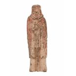 A tomb pottery sculpture of a standing warrior with a sword. Traces of polychromy. On wooden base.