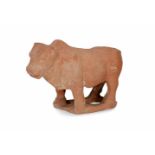 A terracotta sculpture of a bull. China, Tang. H. 11,5 cm. L. 116 cm.