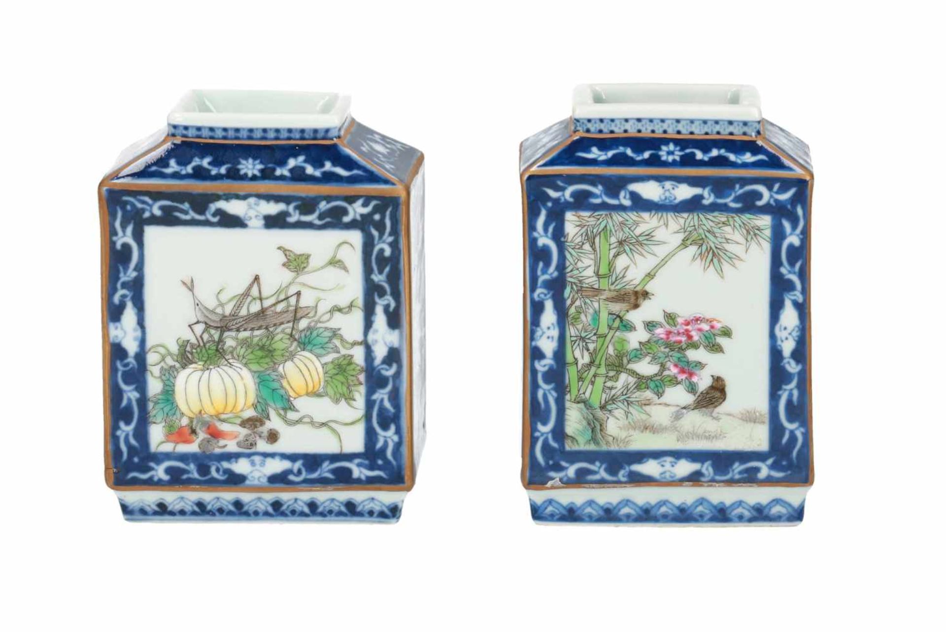 A pair of polychrome miniature vases decorated with flowers, birds and insects. Marked with