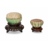 A lot of two pottery lidded bowls with a lobbed body. With celadon green iridescent glaze. On