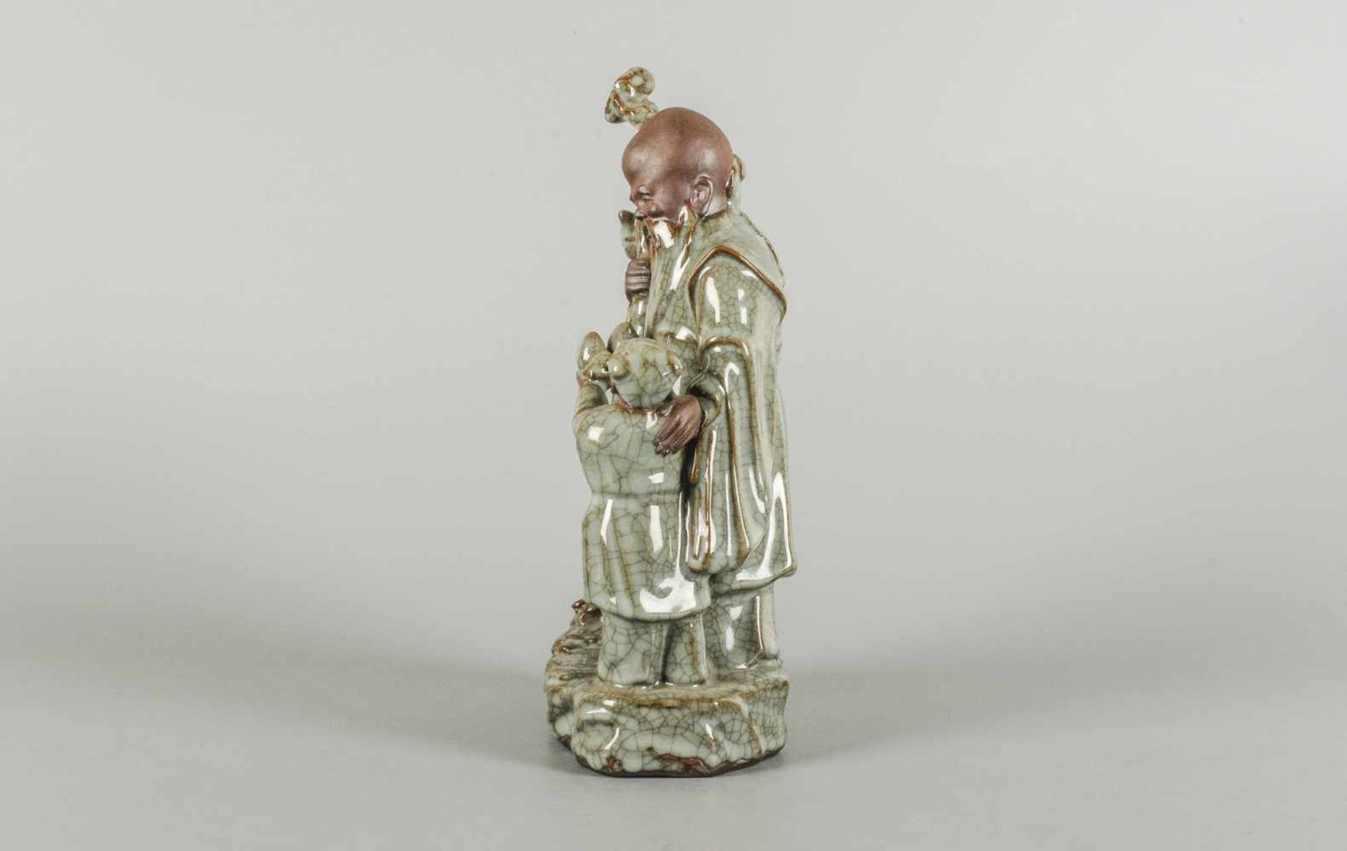 A glazed ceramic sculpture depicting an old man and a child. Unmarked. China, Lonzquan, 20th - Image 3 of 6