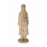 An earthenware standing equestrian with long robe and high boots. Possibly part of a groupscene.